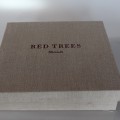 A box filled with Red Trees.